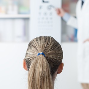 Young woman receiving eye test