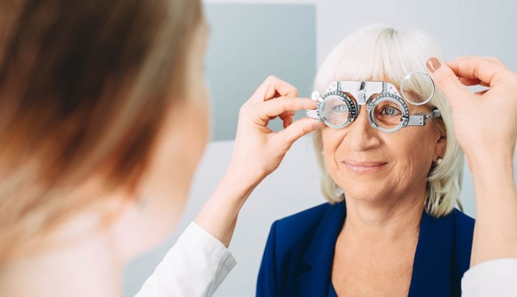 Elderly Woman Receiving Cataracts Test From OPMT Optometrist