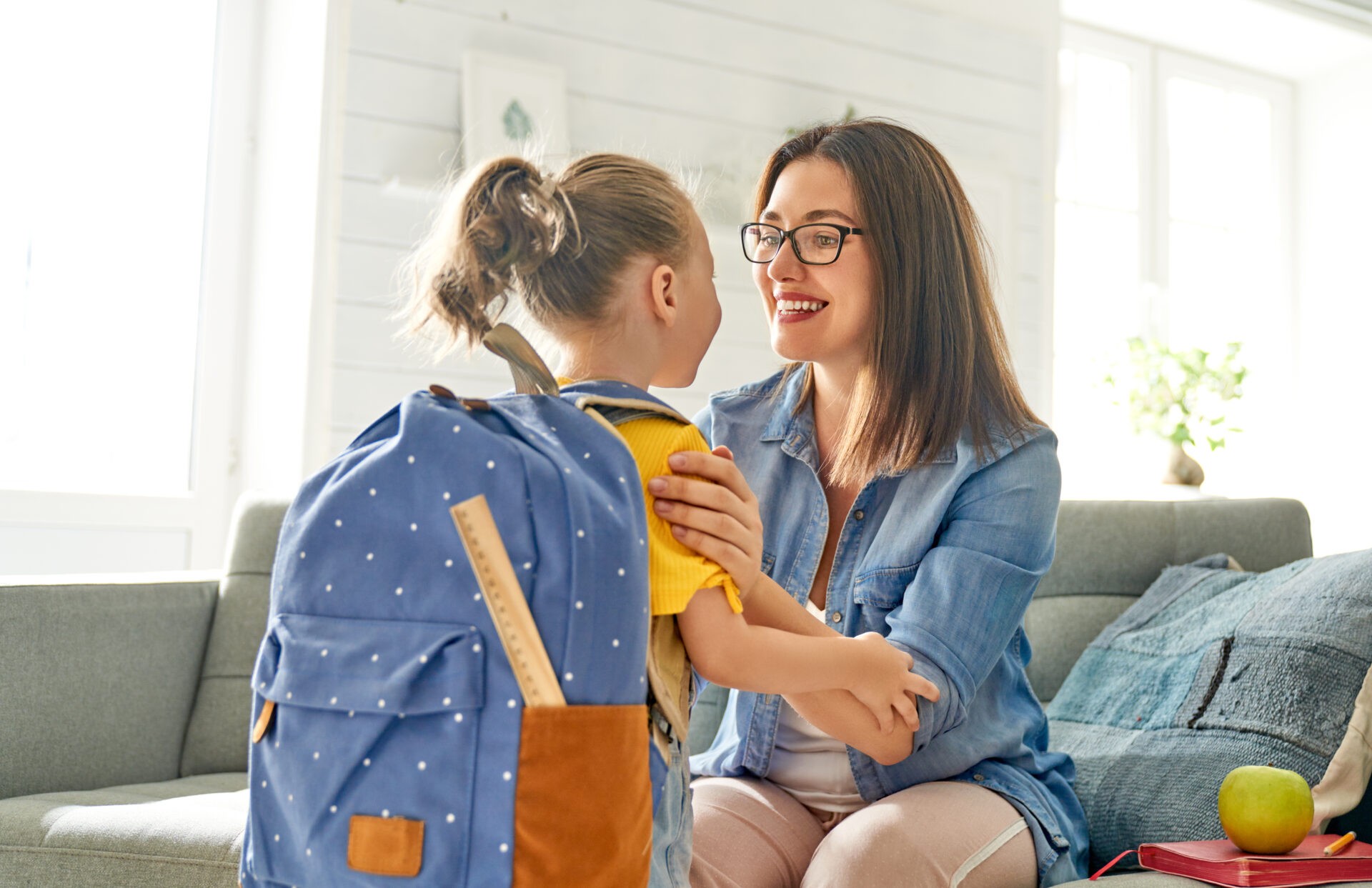 Parent,And,Pupil,Of,Preschool.,Woman,And,Girl,With,Backpack Father and daughter wearing eyeglasses from OPMT Vision Centers