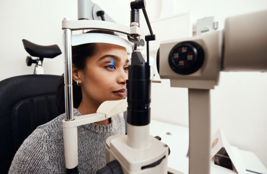 Woman eye exam and treatment at OPMT