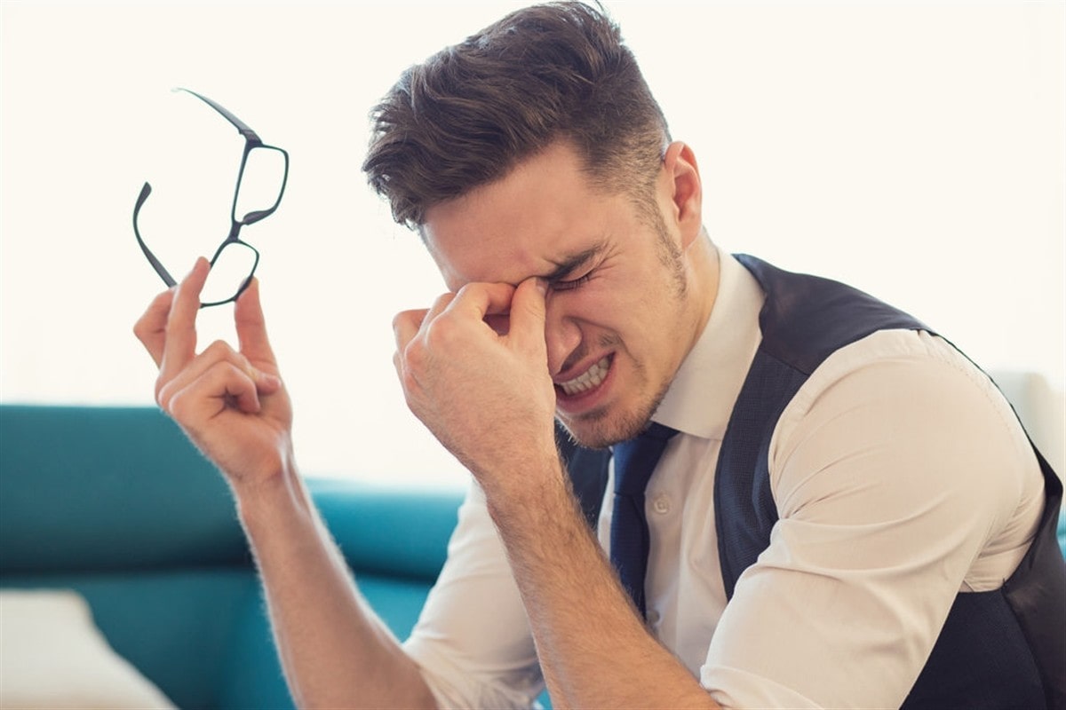 Man suffering from headache at OPMT